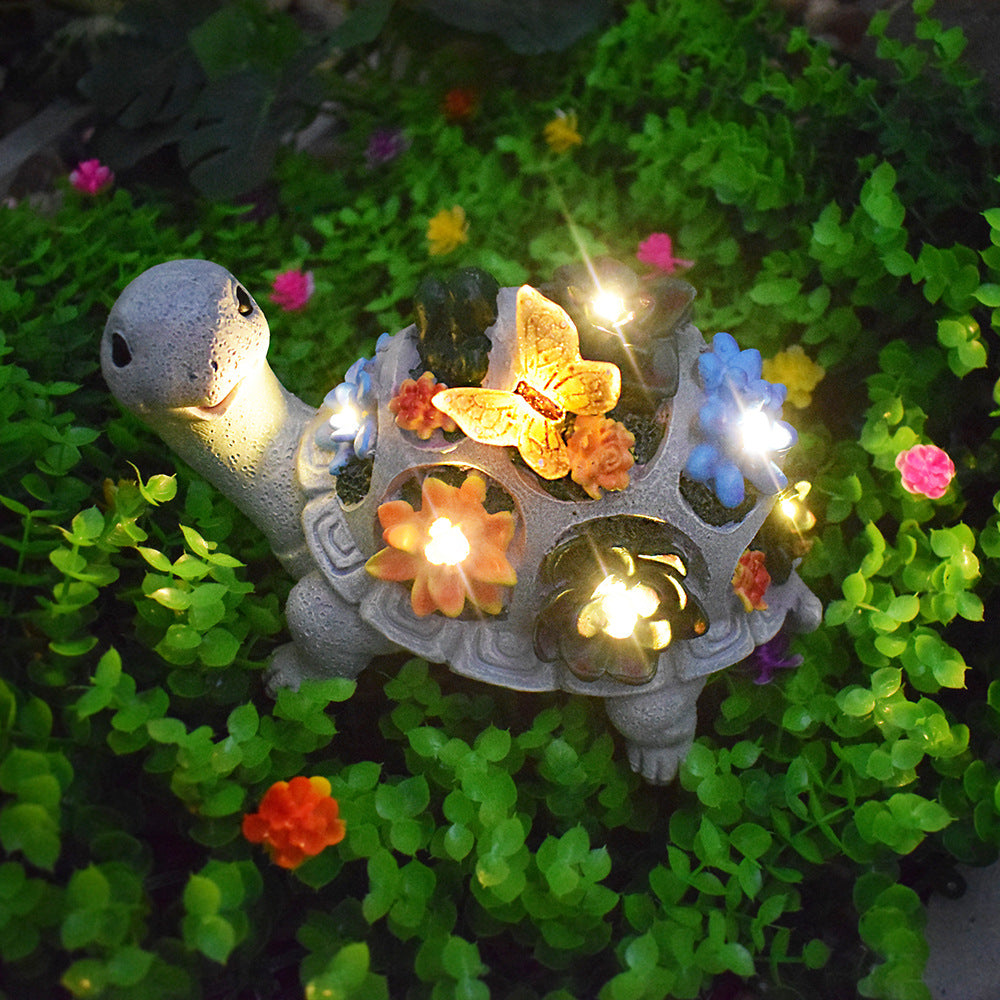 Solar-powered garden gnome sculpture with integrated LED fairy lights and turtle pot