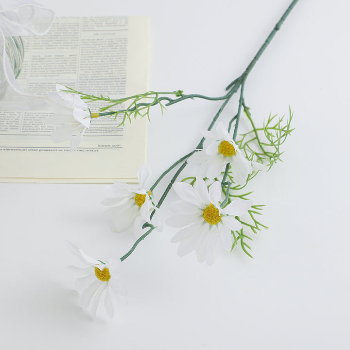Artificial flower branch with bright blooms and delicate leaves