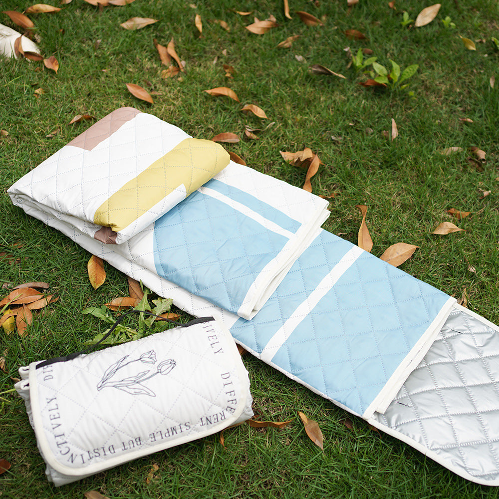Quilted bedspread with large floral appliqué and diamond quilted relief