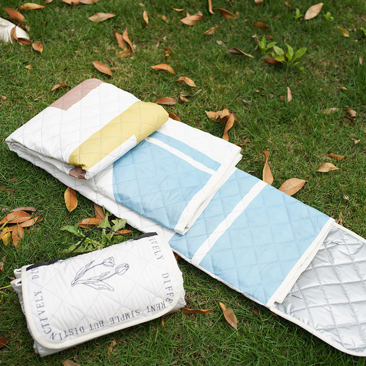 Quilted bedspread with large floral appliqué and diamond quilted relief