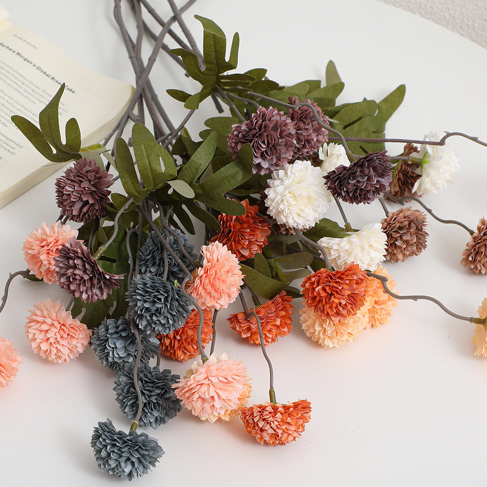 Artificial flower branch with intricate flowers