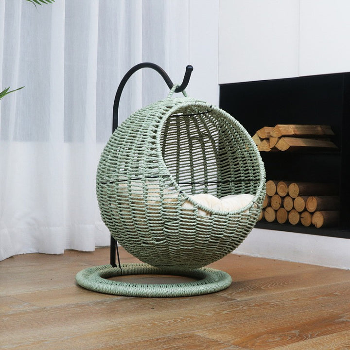 Hanging chair made of rattan with comfortable cushion