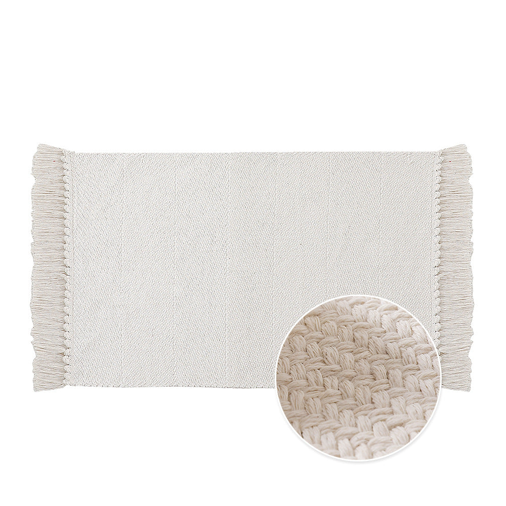 Woven table runner made of cotton blend with fine structure and herringbone look as well as decorative fringes