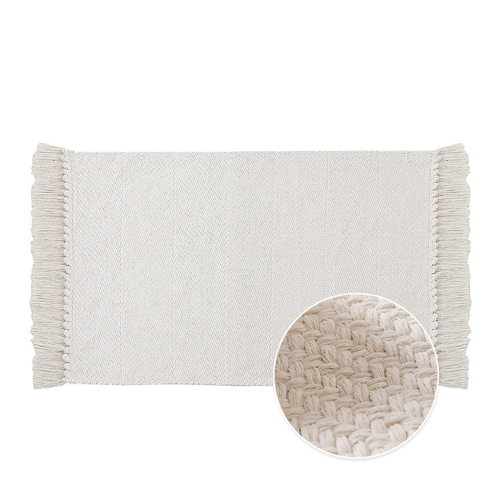 Woven table runner made of cotton blend with fine structure and herringbone look as well as decorative fringes
