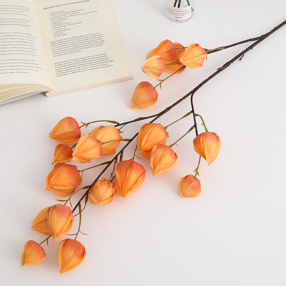 Artificial flower branch with vibrant flowers