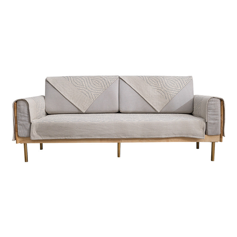 Quilted cover for sofa with armrest protectors and non-slip underside