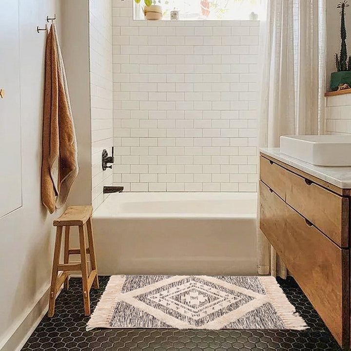 decorative woven bathroom runner with botanical jacquard pattern and fringes