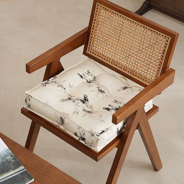 Padded square seat cushion with tufted stitching and fine bamboo print