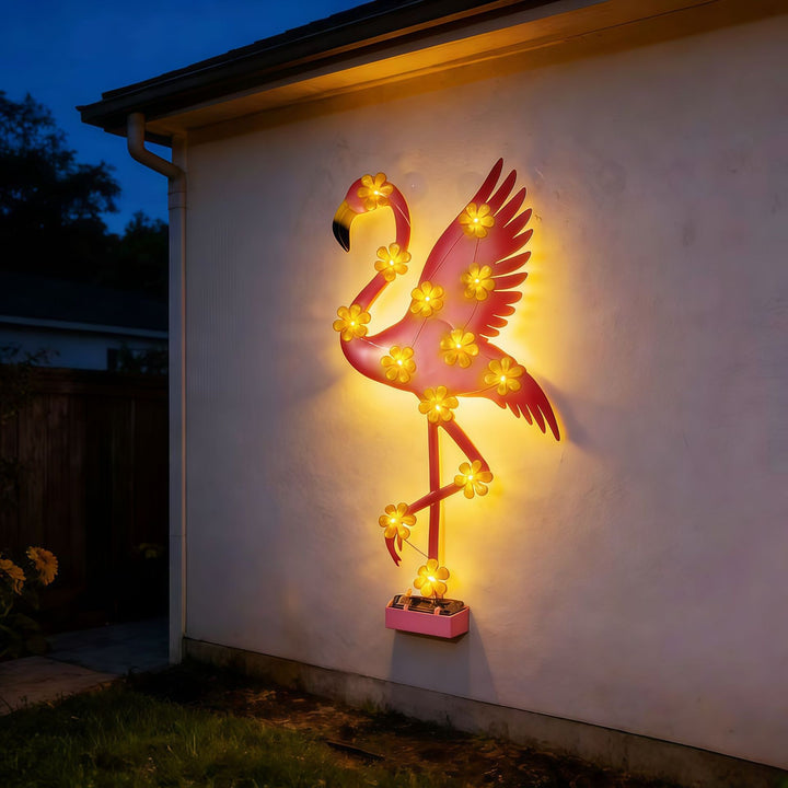 Solar-powered Flamingo LED garden stake light with flower accent lamps