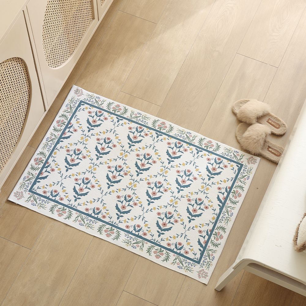 Woven cotton bath mat with floral allover jacquard pattern