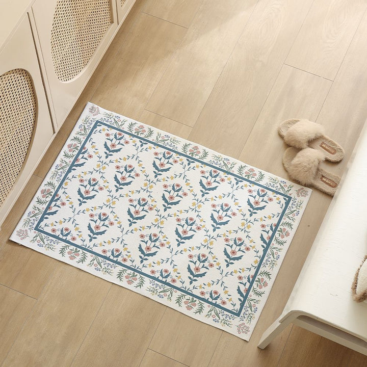 Woven cotton bath mat with floral allover jacquard pattern