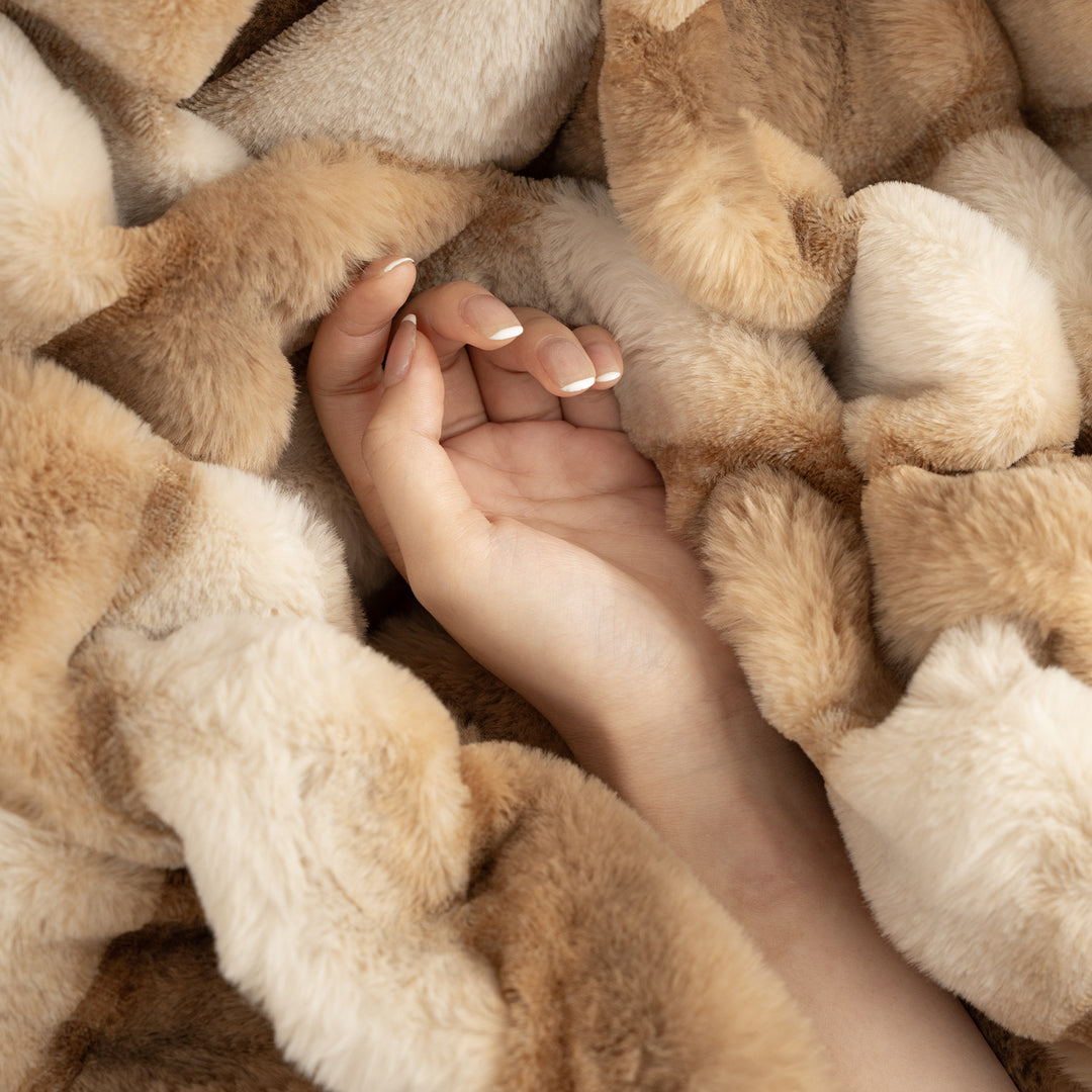 Luxurious cozy faux fur blanket with quilted relief pattern