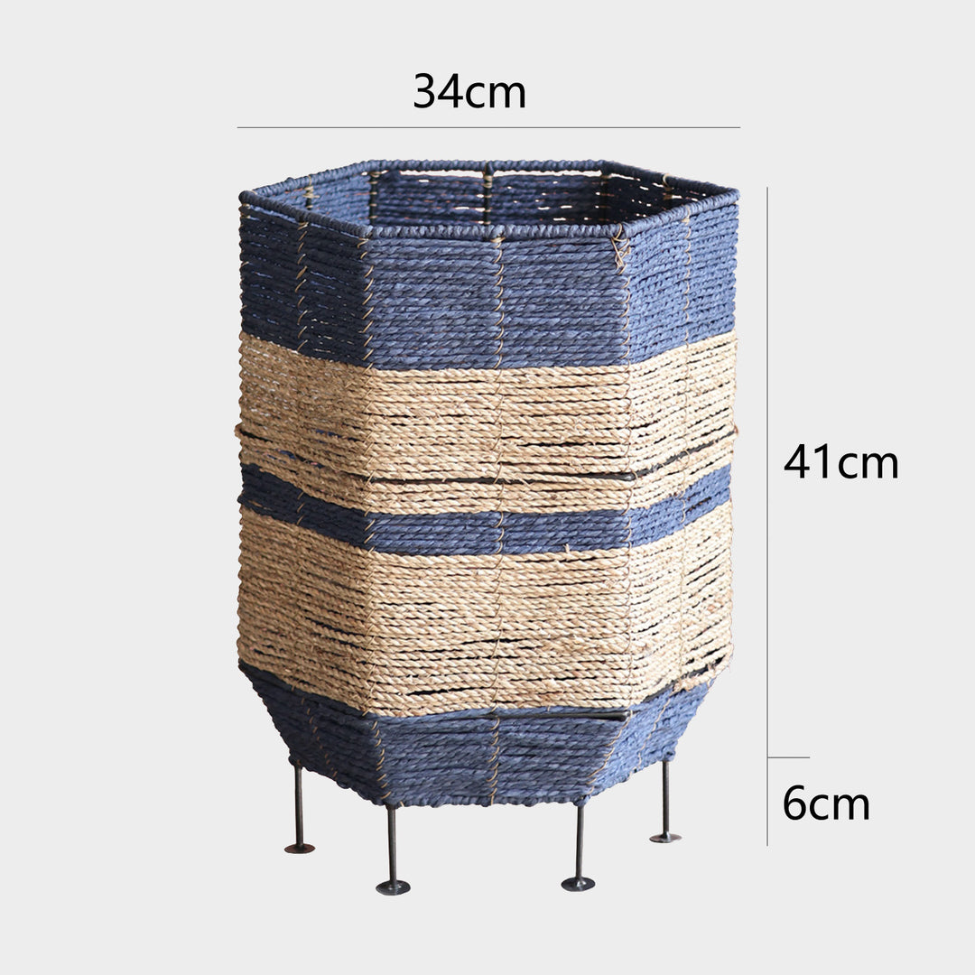 Stylish laundry basket made of rattan with metal legs