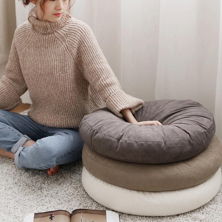 Round seat pouf with soft velvet cover, removable zipper, and shape-stable filling