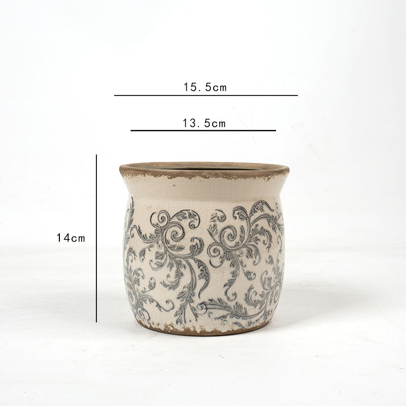 Decorative ceramic plant container with artistic design