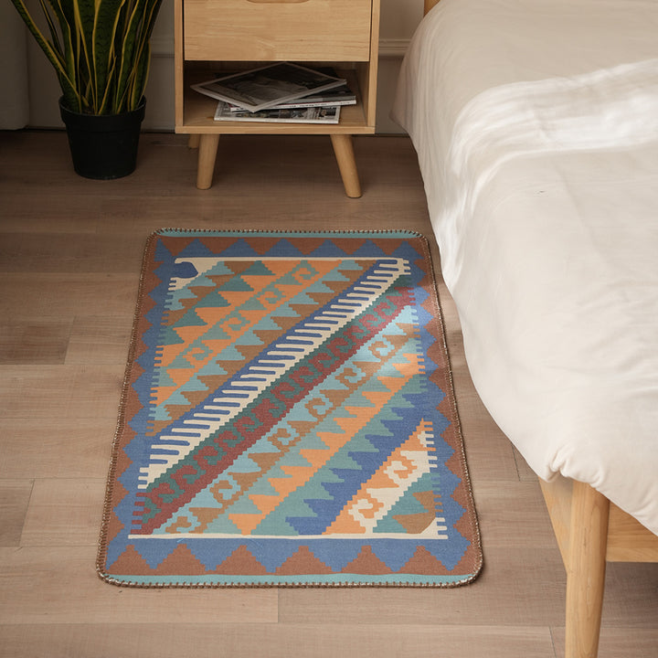Woven runner rug in ethnic kilim pattern with flat weave structure and non-slip backing