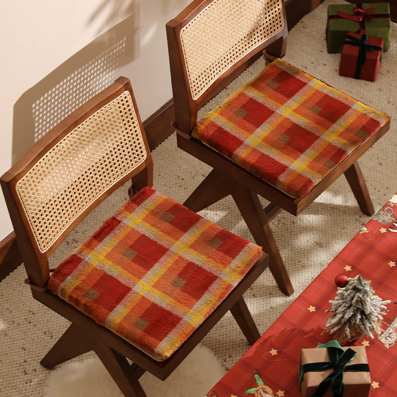 Padded chair cushion with checked plush cover and fastening ties