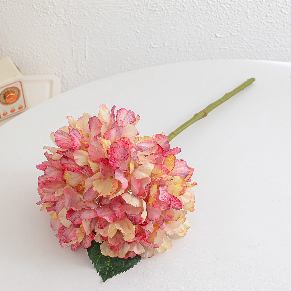 Artificial flower branch with realistic flowers