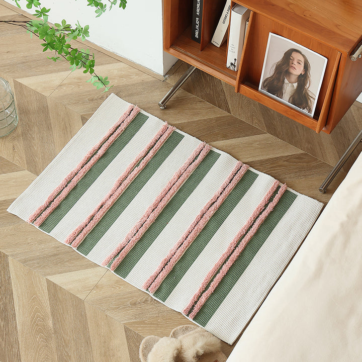 Cotton bath mat with textured stripes and fringes