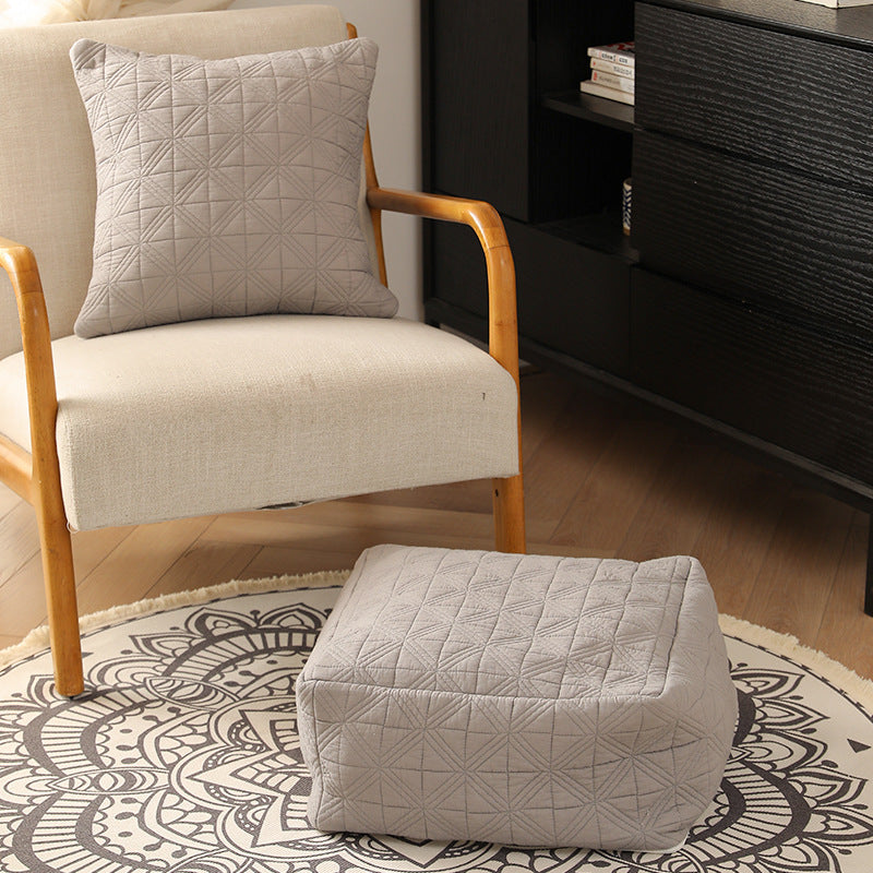 Padded floor seat pouf made of quilted cotton blend