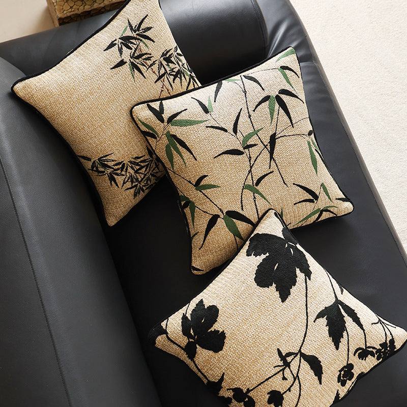 Square decorative pillow with embroidered bamboo design and natural linen texture