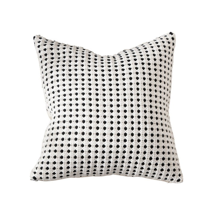 Woven decorative pillow with textured dot tufting