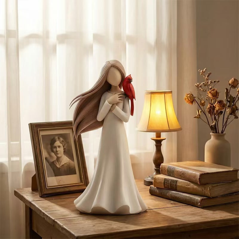Figurine Holding Bird