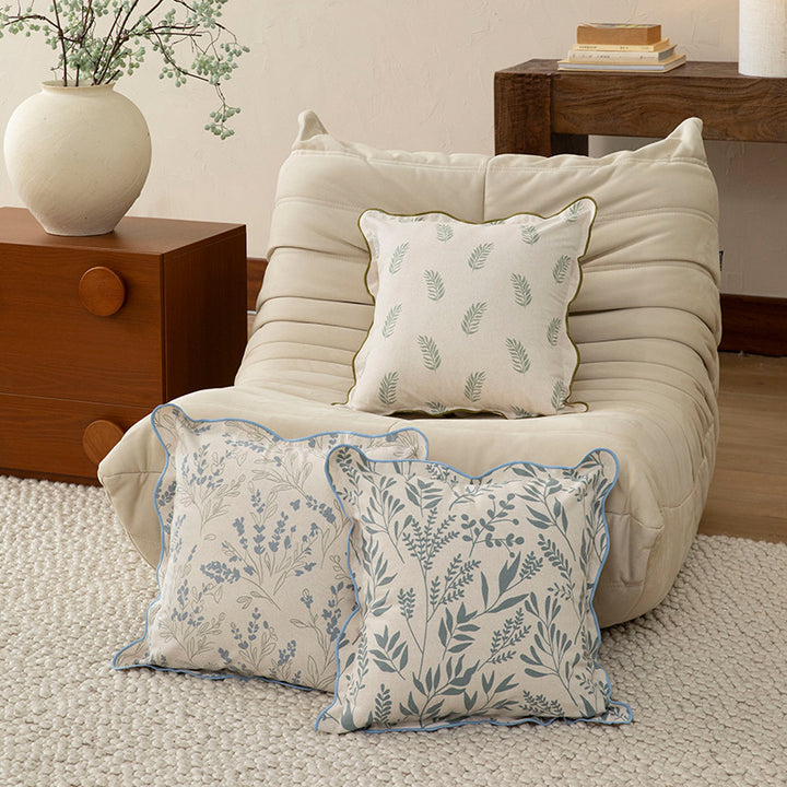 Decorative square decorative pillow with floral print, curved edge and removable cover