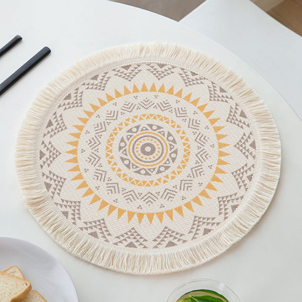 Round woven placemat with fringes and mandala jacquard structure