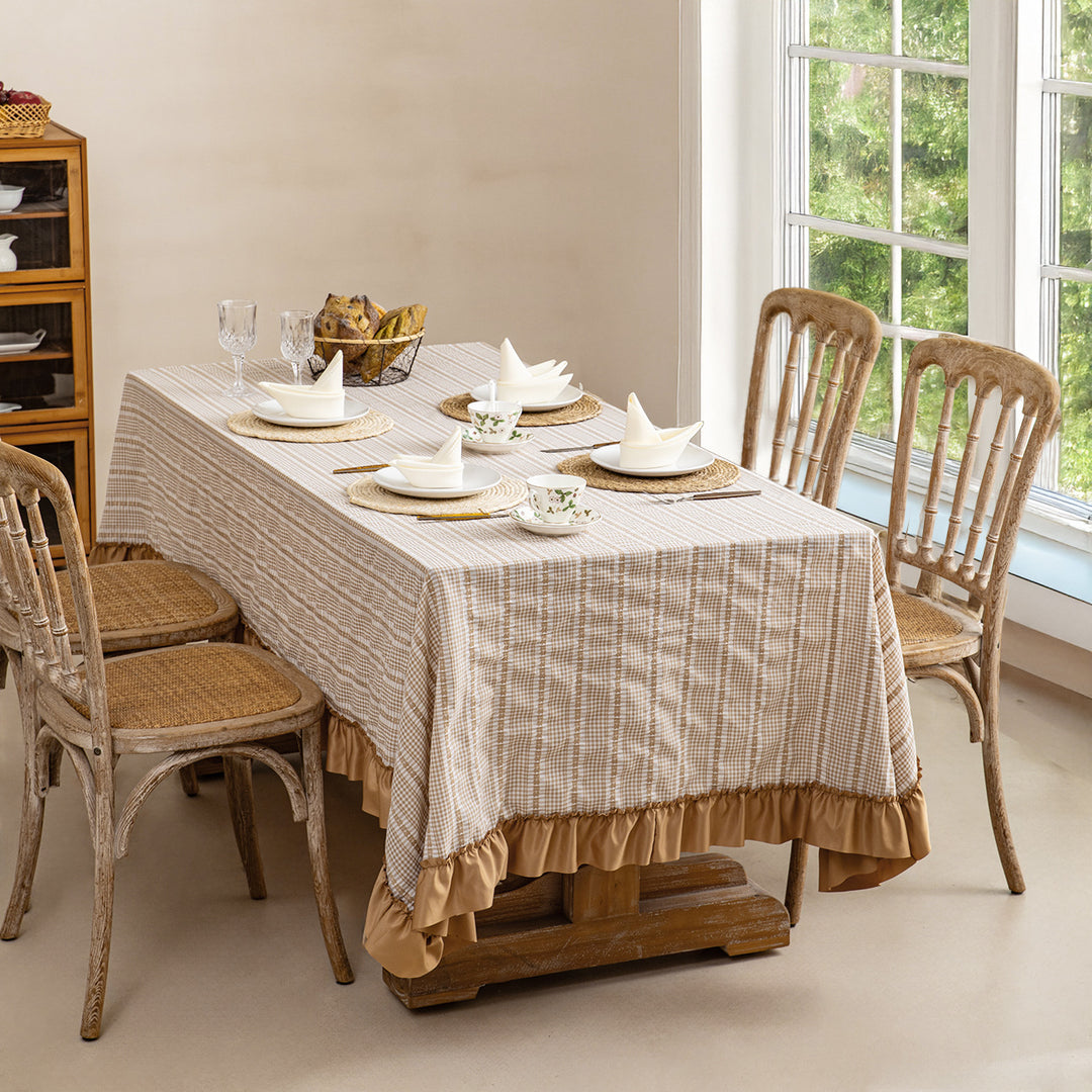 Rustic country house tablecloth made of cotton blend fabric with fine check pattern and ruffled hem