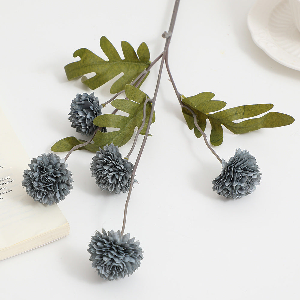 Artificial flower branch with intricate flowers