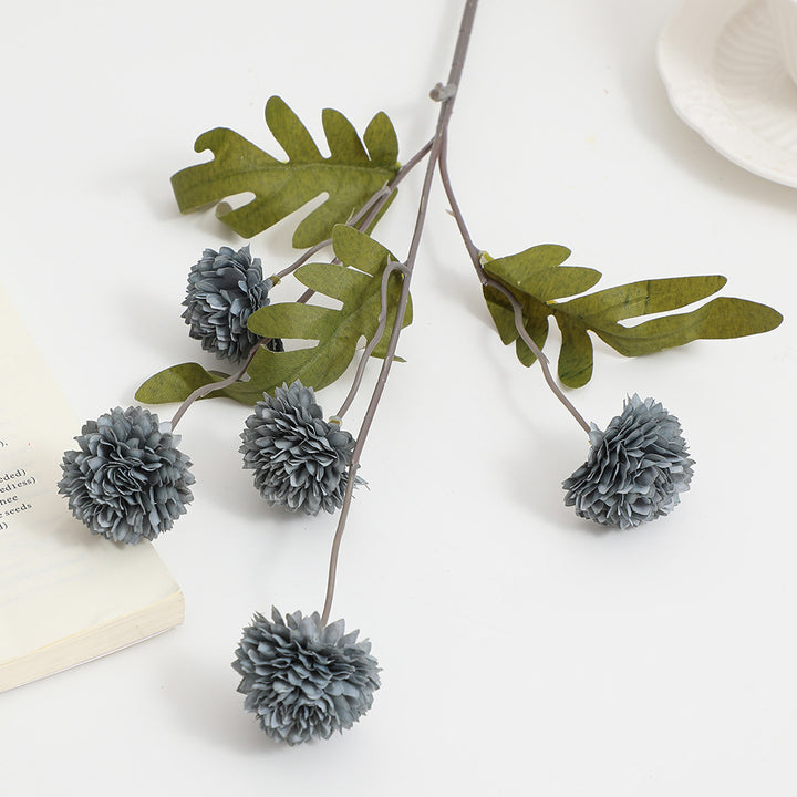 Artificial flower branch with intricate flowers