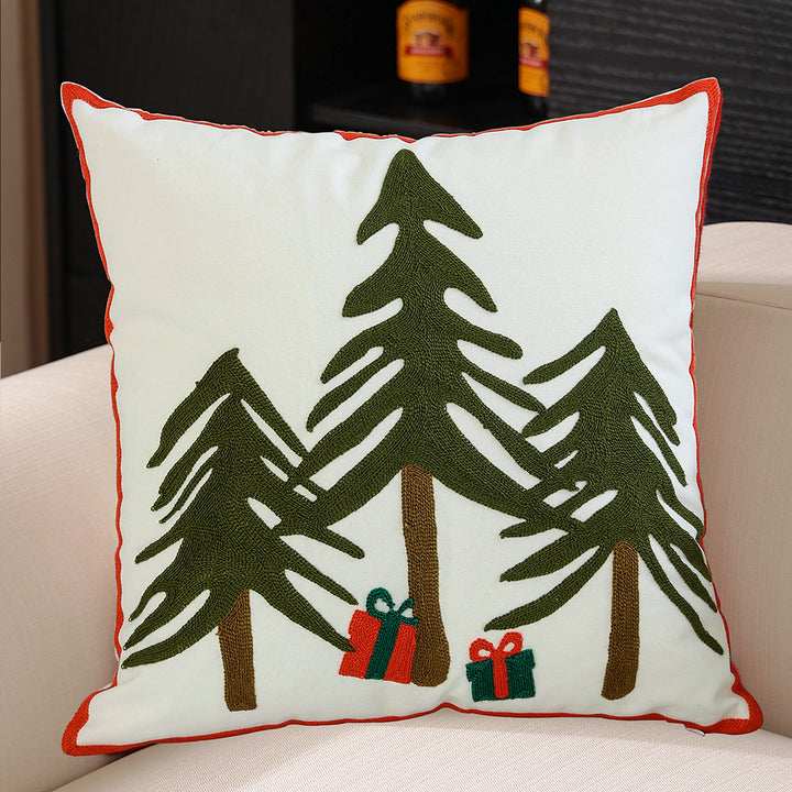 Decorative cushion cover with festive Christmas star print and pom-pom trim