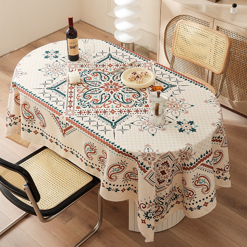 Water-repellent rectangular tablecloth with paisley pattern and coated cotton look