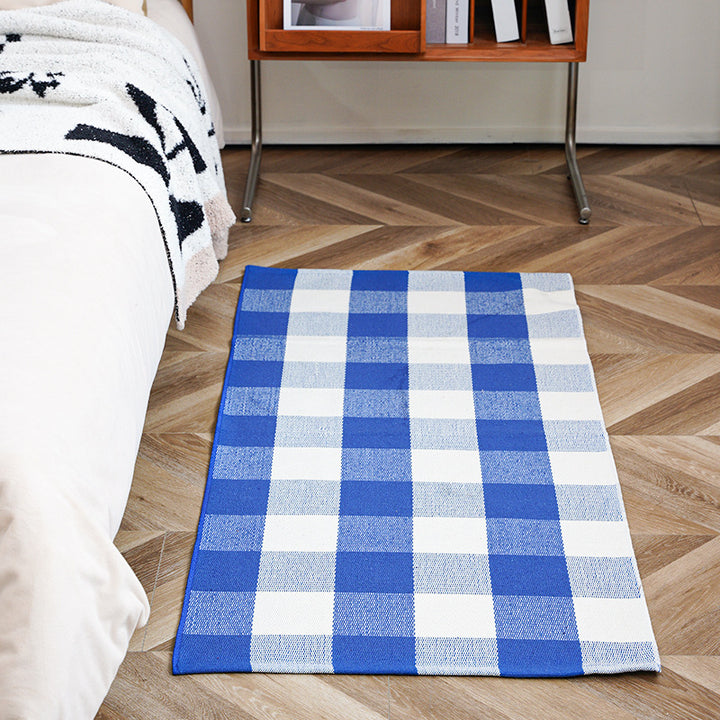 Flat-woven runner rug with check pattern and decorative border stripe