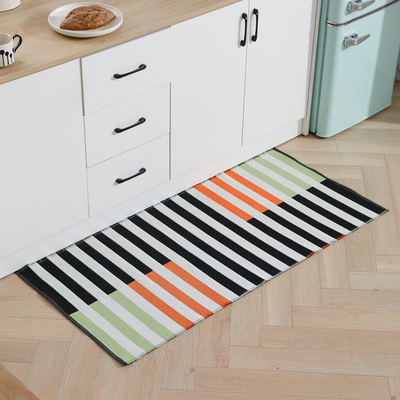 Flat-woven kitchen runner with modern striped pattern and easy-care cotton blend