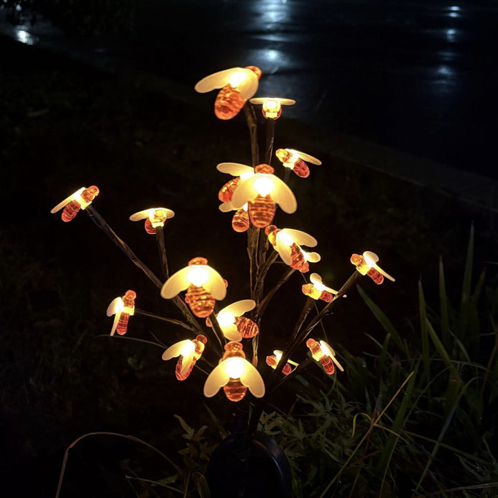 Battery-operated animated bat and spider LED string lights for outdoor Halloween display