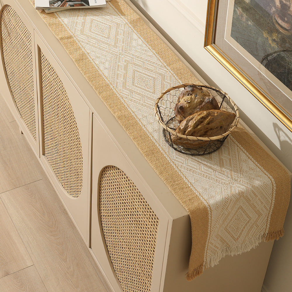 Handwoven table and console runner made of cotton blend fabric with geometric diamond pattern and fringes