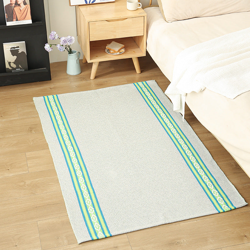 Modern flat-weave area rug with contrasting stripes and non-slip underside