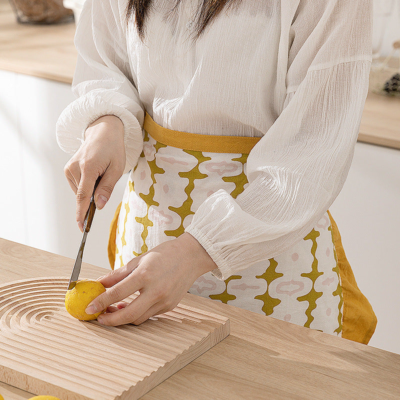 Waist apron with ruffles and woven geometric pattern