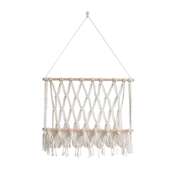 Elegant macramé wall hanging with decorative tassels and wooden frame