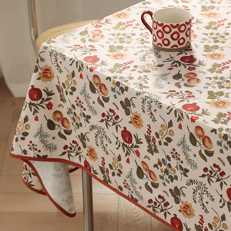 Coated tablecloth in country house style with botanical print and fine hem