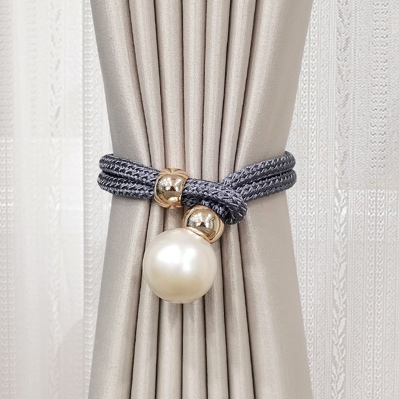 Elegant curtain tieback with decorative pearl