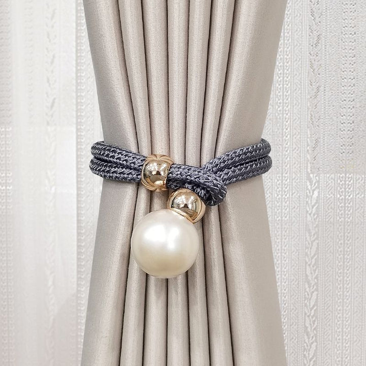 Elegant curtain tieback with decorative pearl