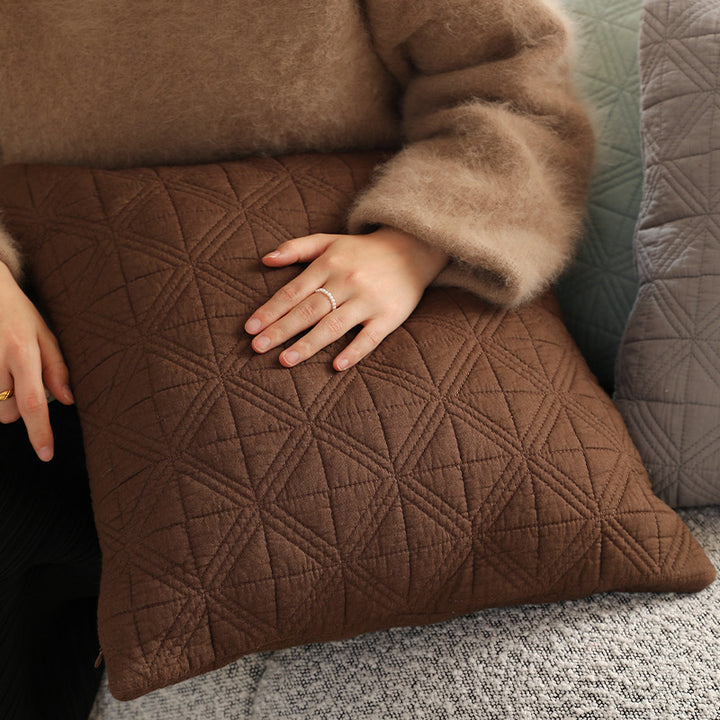 Square quilted decorative cushion made of cotton blend fabric with geometric cross quilted pattern