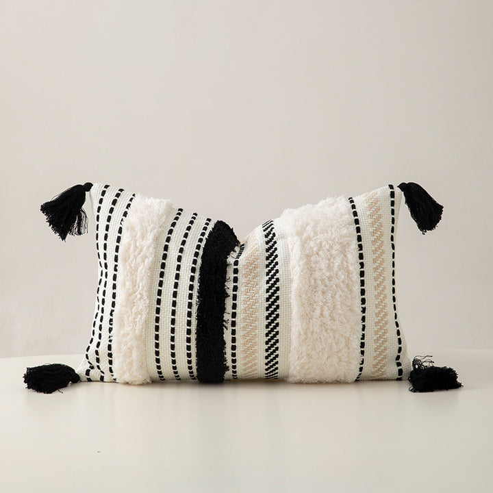 Handwoven decorative cushion cover made of cotton blend with tassels and structured stripe look