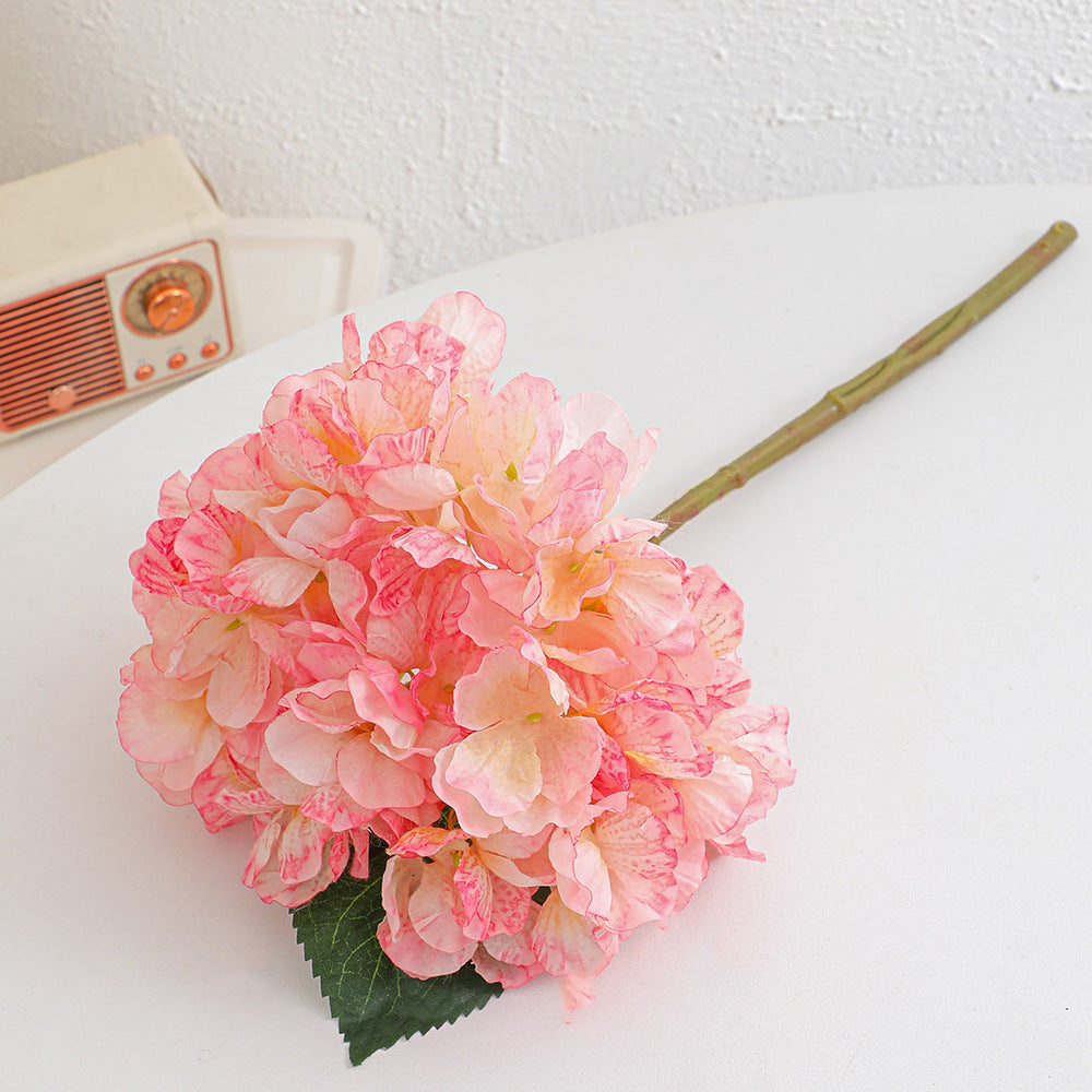 Artificial flower branch with realistic flowers