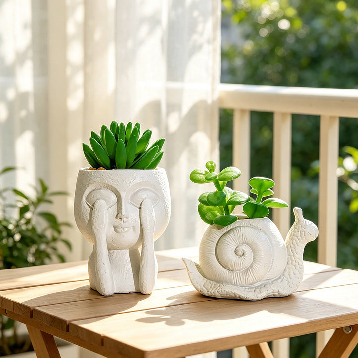 Plant pot with face motif