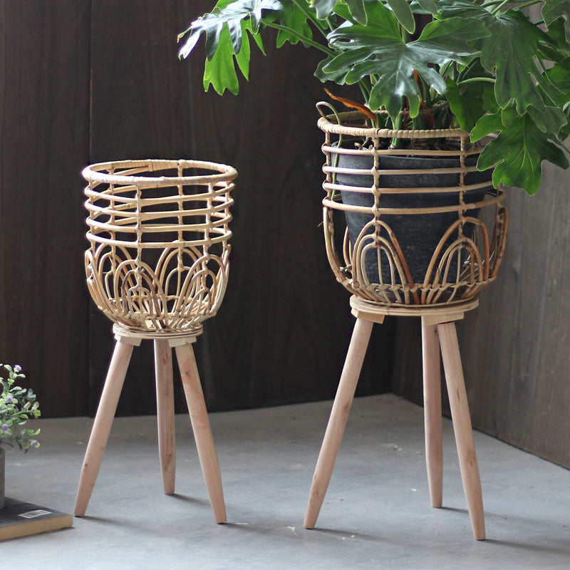 Stylish plant stand made of rattan and wood