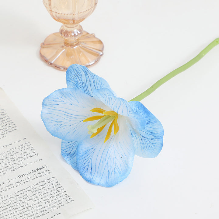 Artificial orchid flower branch with intricately detailed flowers